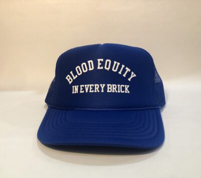 A blue hat with the words " blood equity in every brick ".