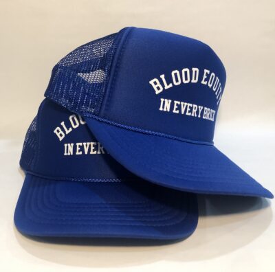 A blue hat with the words blood donor in every name on it.